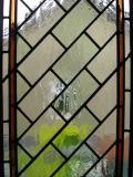 Encapsulated leaded glass